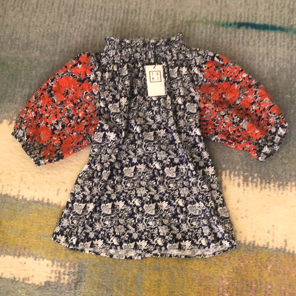 Embroidered top with buttons down back. Navy/White floral, orange embroidery